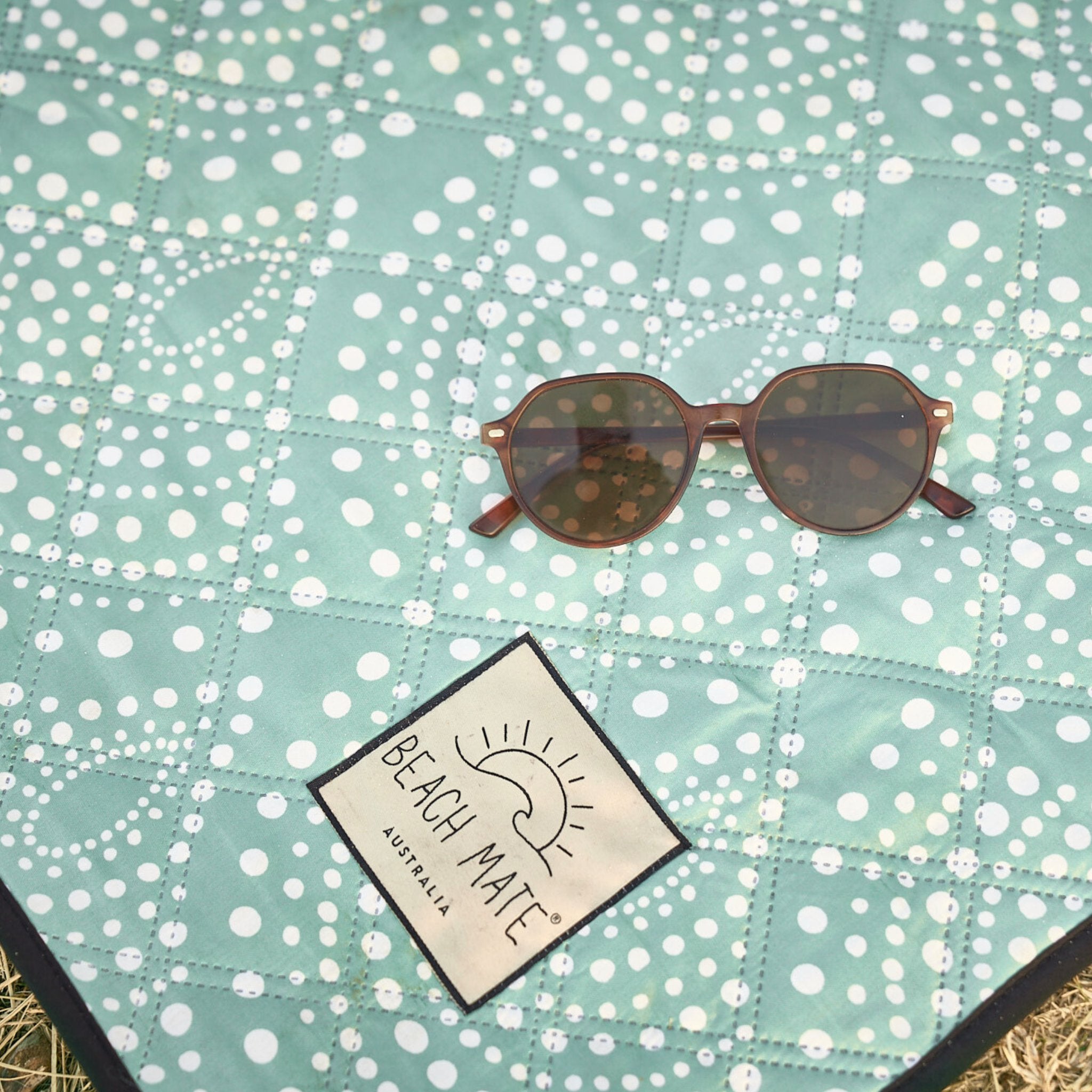 Snapper Rocks Beach Mate close-up showing recycled fabric texture and logo tag.