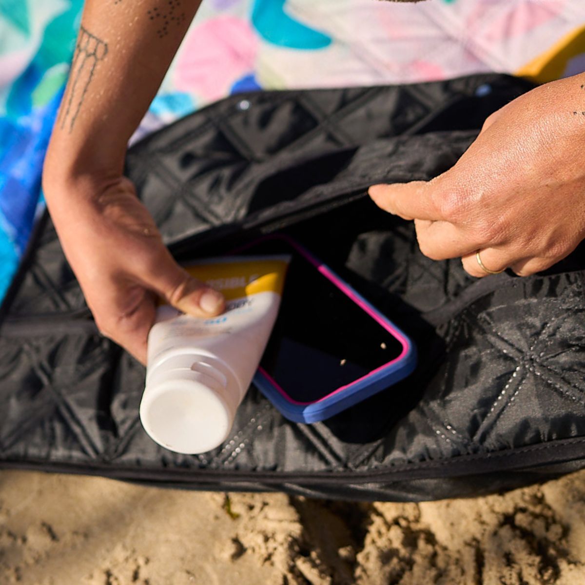 Hidden zip pocket under mat